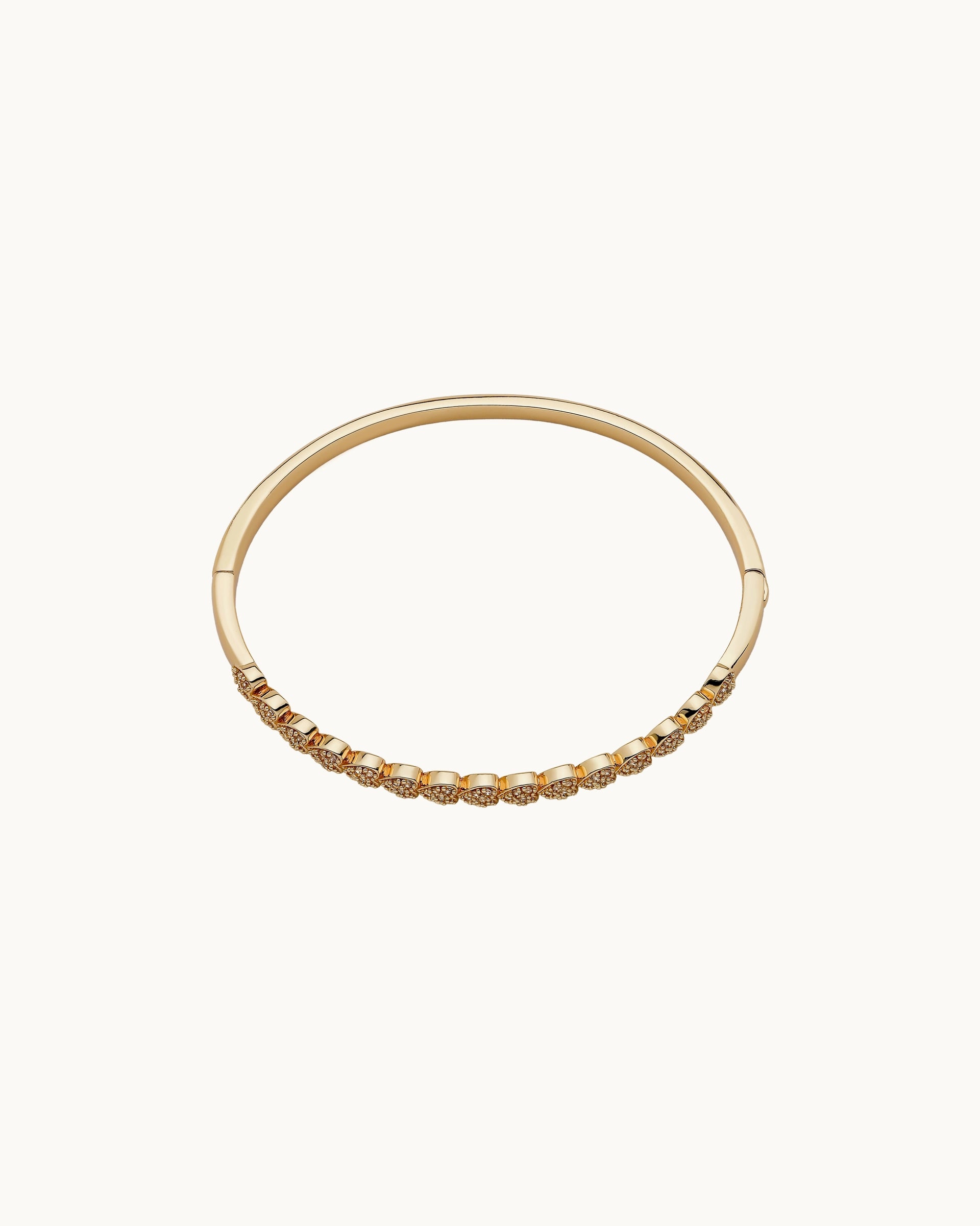 Pavé cubic zirconia heart motif hinged bangle in silver, by Kaleido Jewellery Singapore.
Pavé cubic zirconia heart motif hinged bangle in gold, by Kaleido Jewellery Singapore.