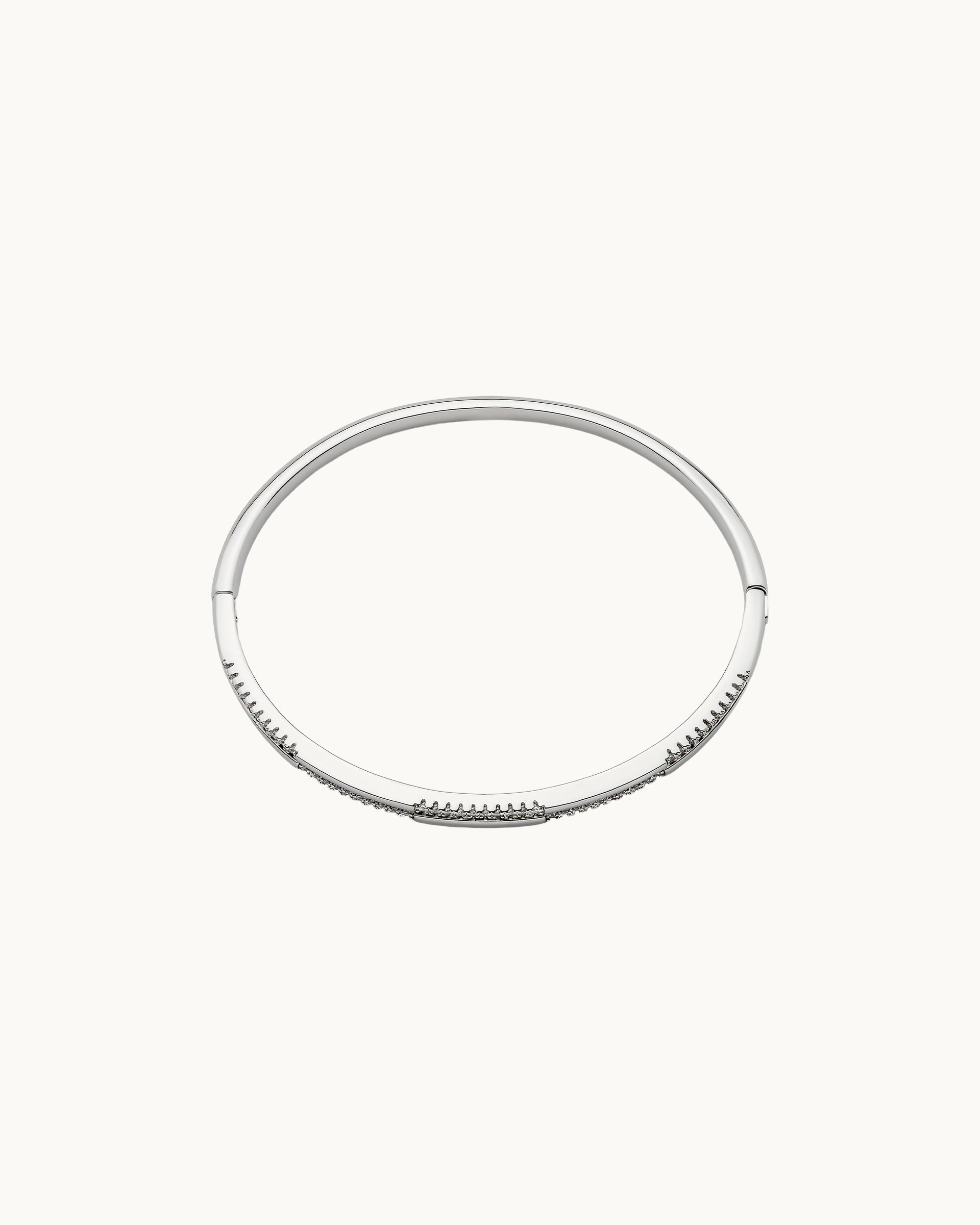 Sparkling round cubic zirconia double rail hinged bangle in silver, by Kaleido Jewellery Singapore.
Sparkling round cubic zirconia double rail hinged bangle in gold, by Kaleido Jewellery Singapore.
