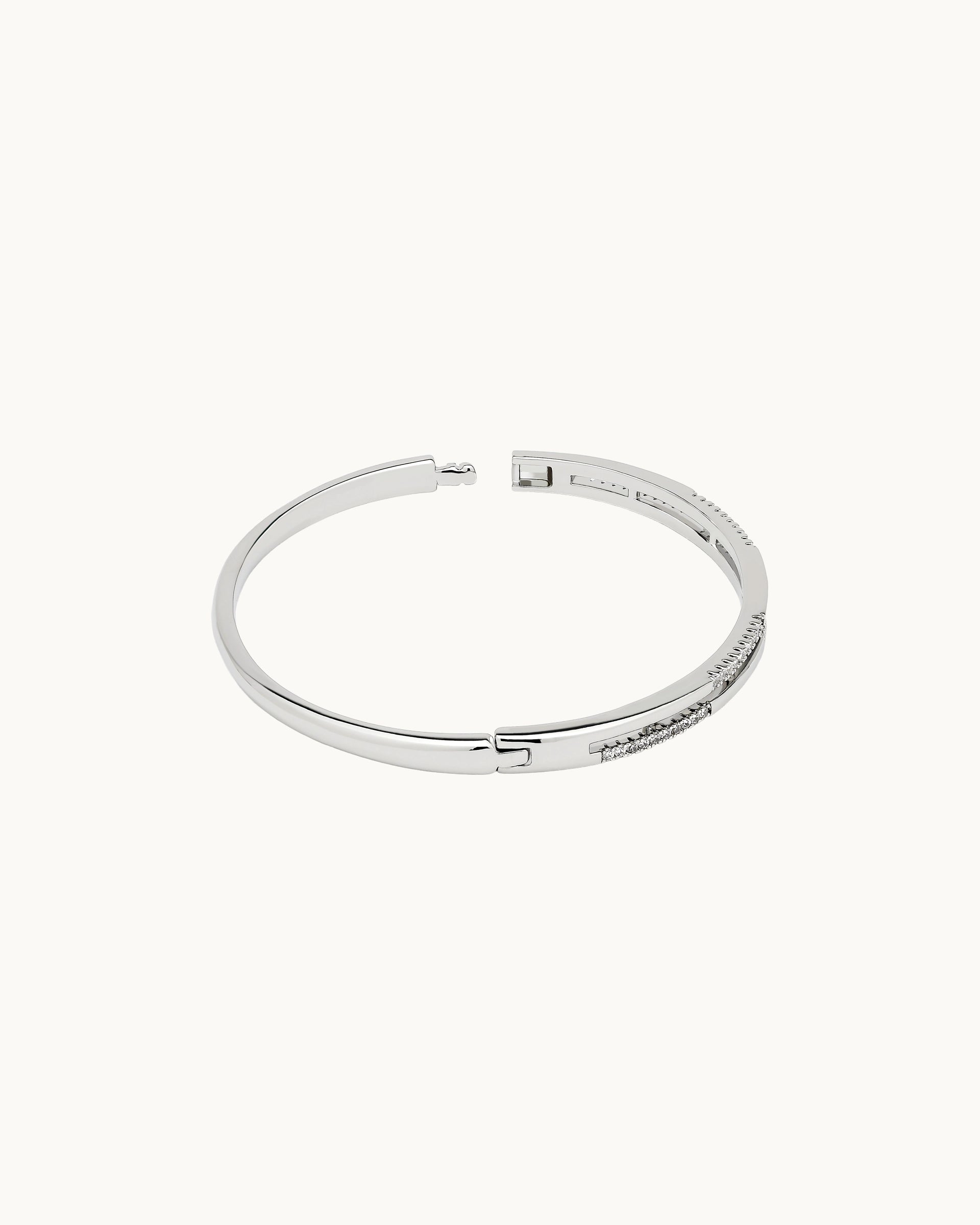 Sparkling round cubic zirconia double rail hinged bangle in silver, by Kaleido Jewellery Singapore.
Sparkling round cubic zirconia double rail hinged bangle in gold, by Kaleido Jewellery Singapore.