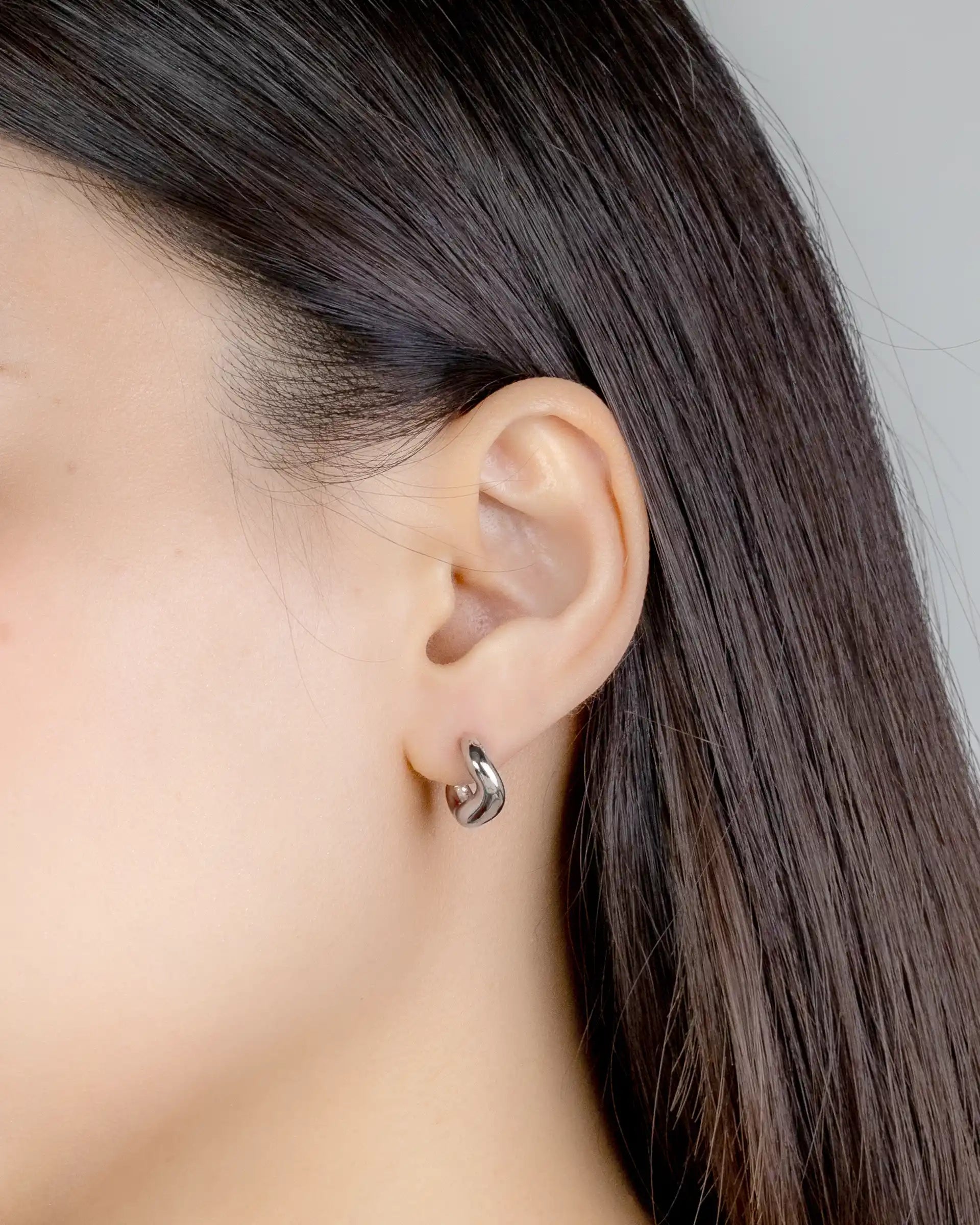 Phyllis Sculptural Huggie Earrings in Silver
