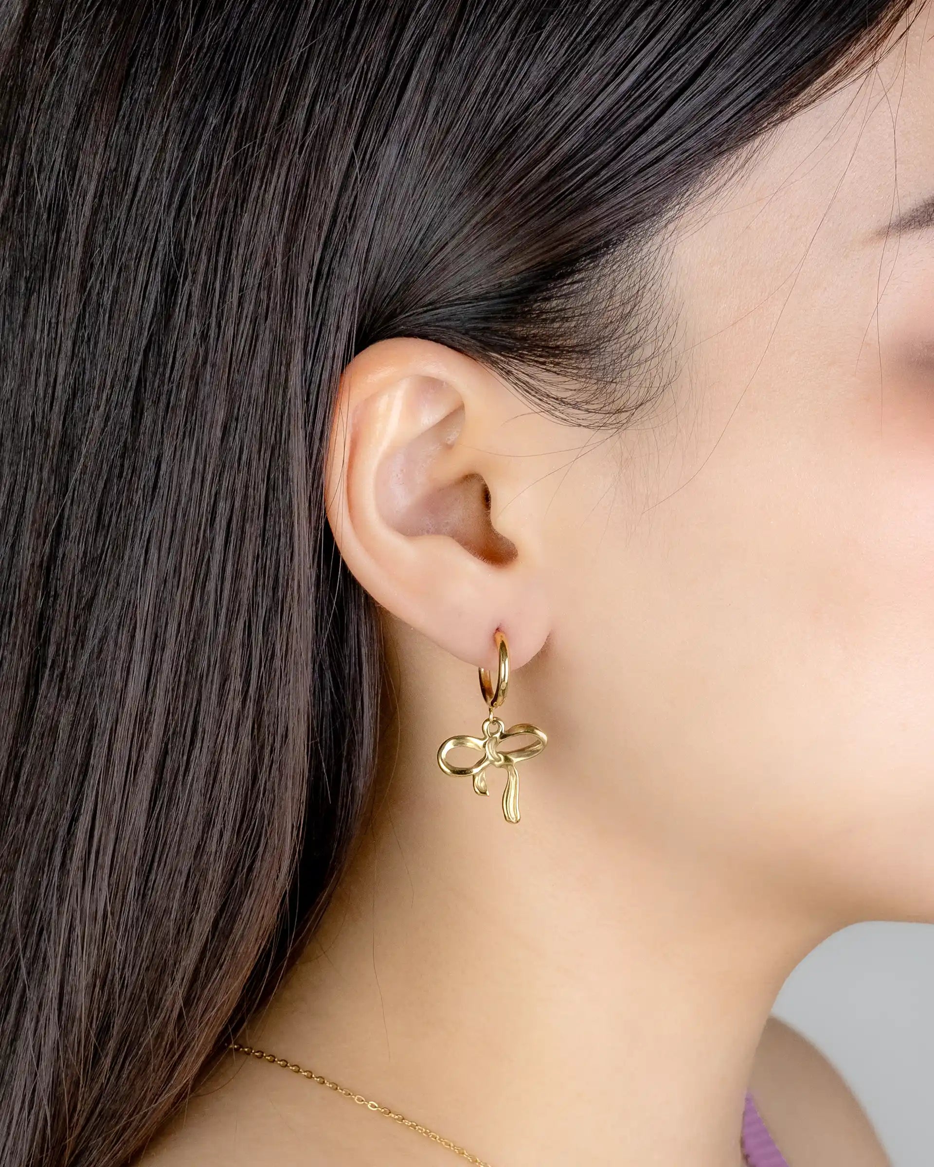 Lela Bow Dangling Hoop Earrings in Gold